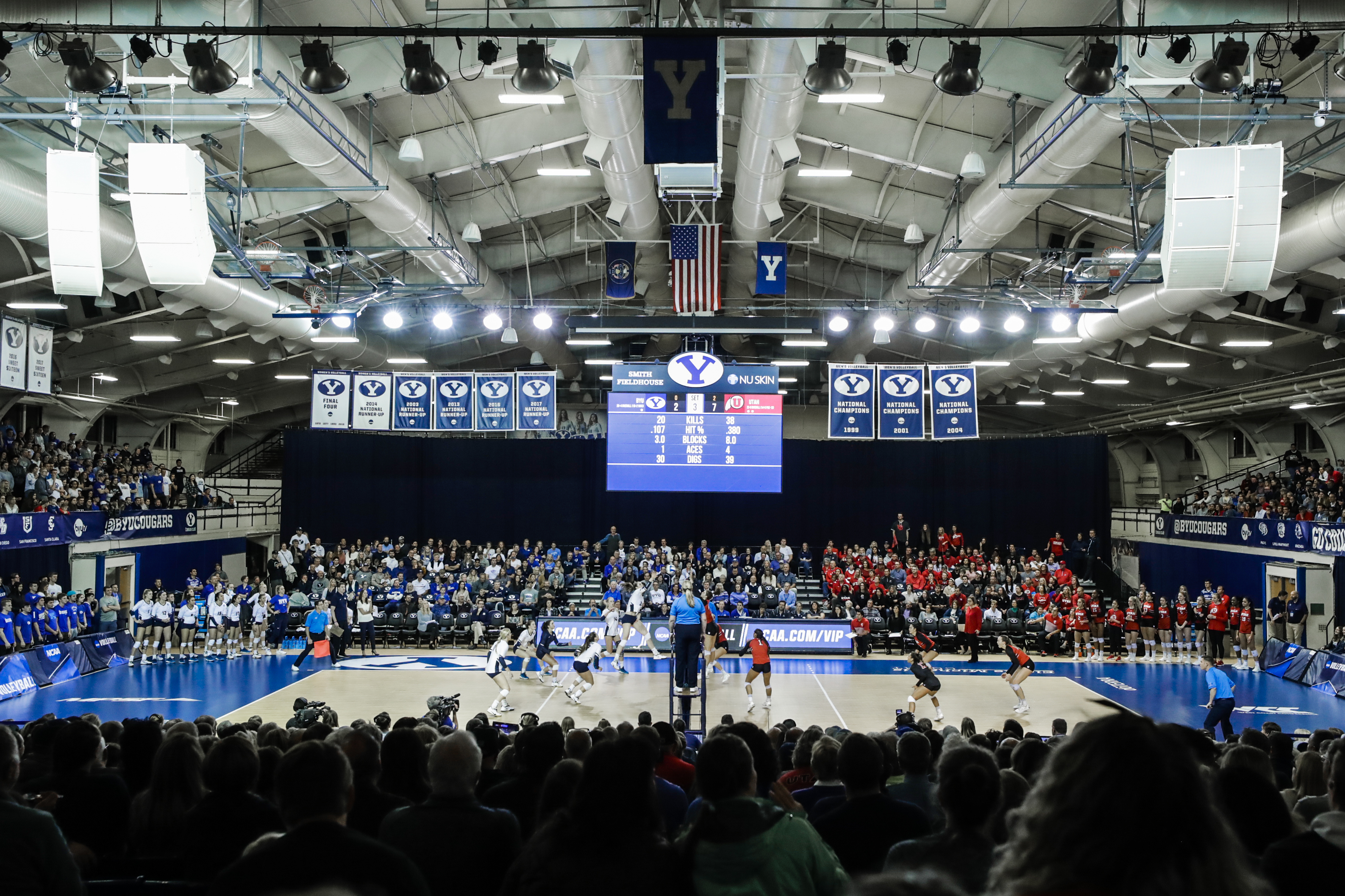 womens volleyball plays in front of big crowd