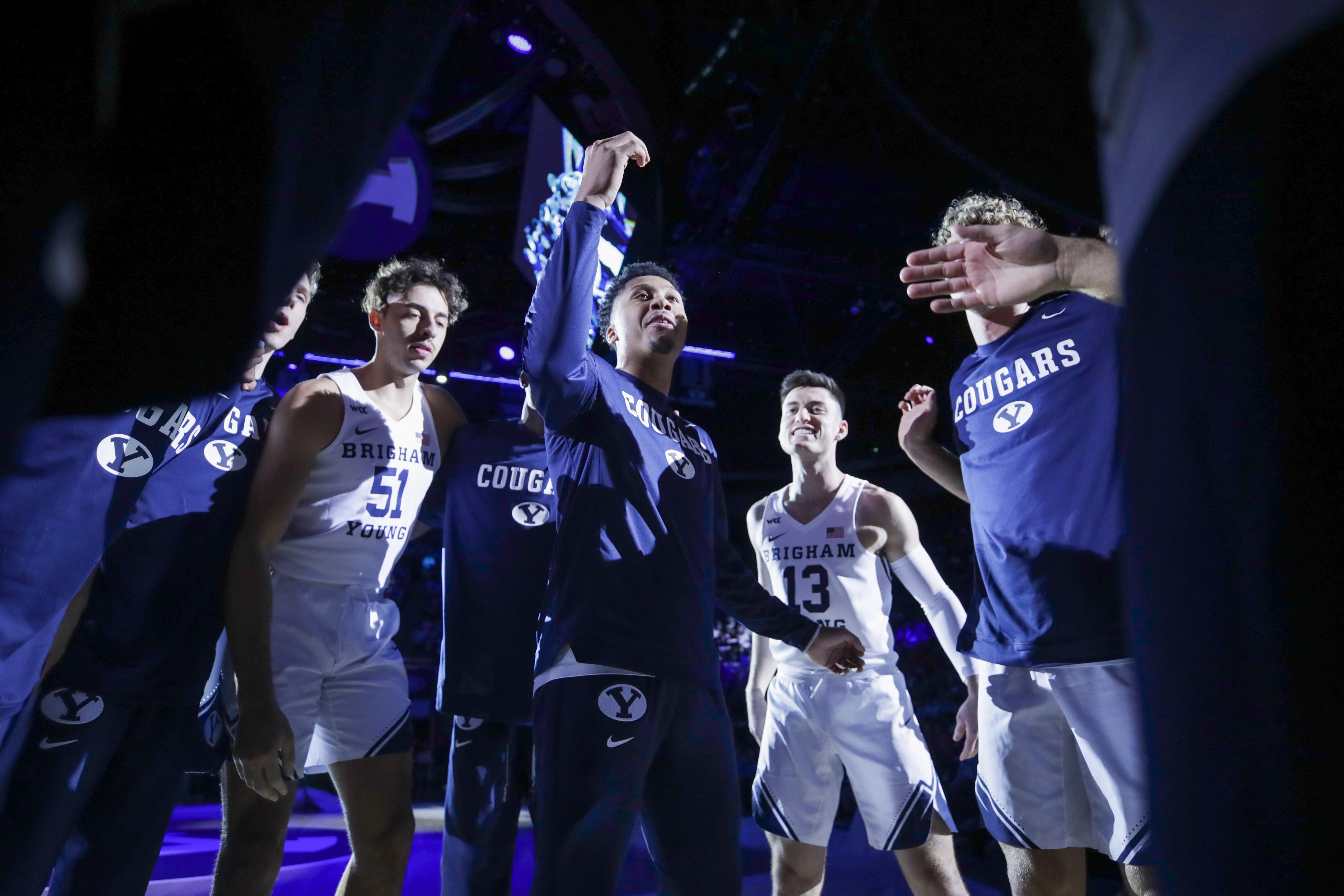 BYU basketball player Te'Jon Lucas dances with the team before the Cougars 97-61 victory over Central Methodist University. 