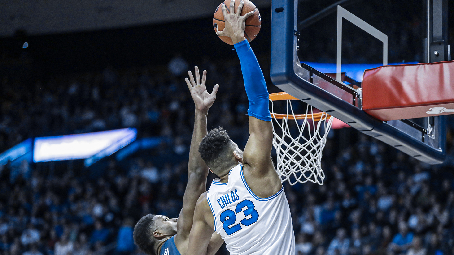 Yoeli Childs dunks the ball with his right hand over an Oral Roberts player in the Marriott Center.