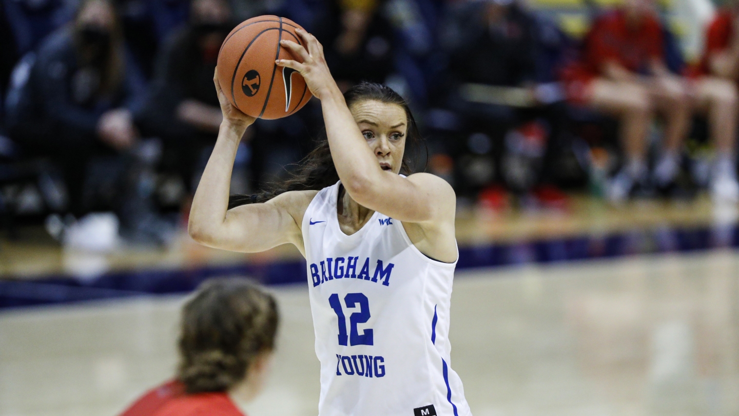 BYU women's basketball's Lauren Gustin holding the basketball against SMC