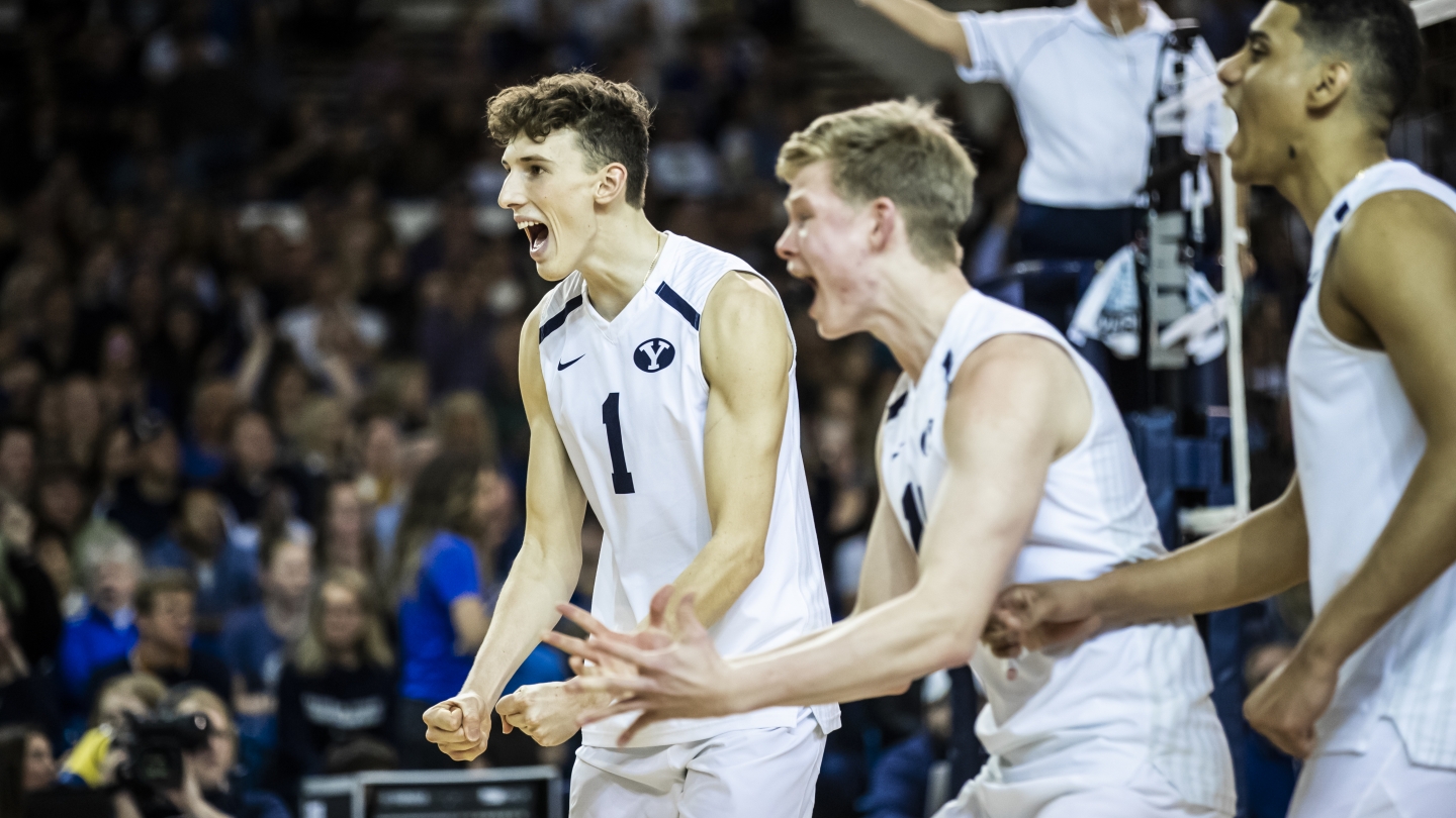 Three BYU players cheering 