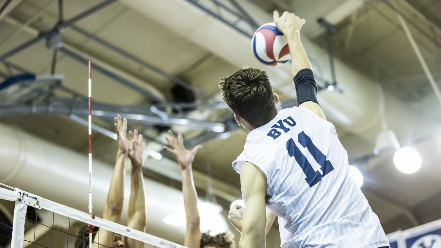 Zach Eschenberg hits over Pepperdine's block