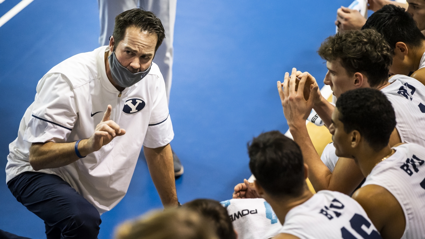 Coach Olmstead speaks to players during a time out 