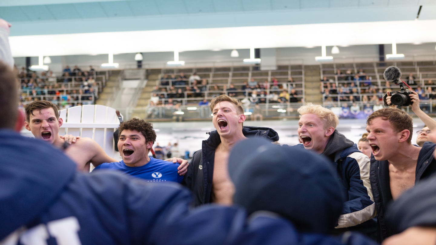 BYU men cheering before starting their meet.