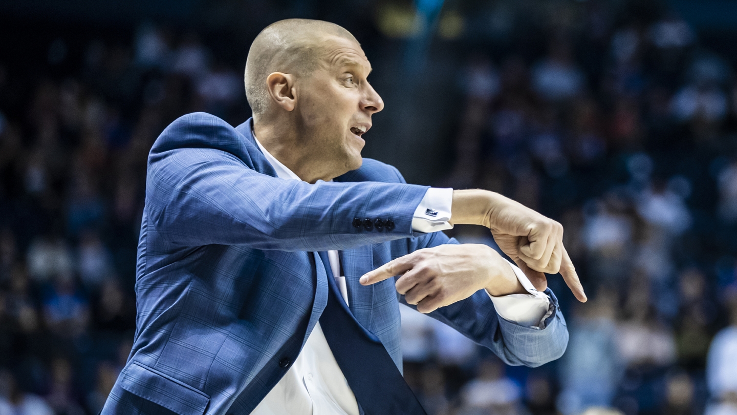 Mark Pope signals a play while coaching against Weber State.