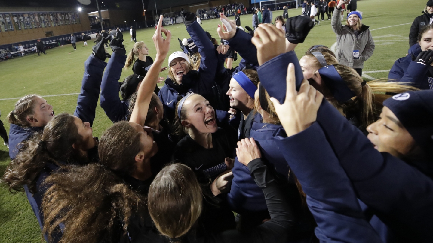 The BYU women's soccer team celebrates a win in the third round of the NCAA Tournament