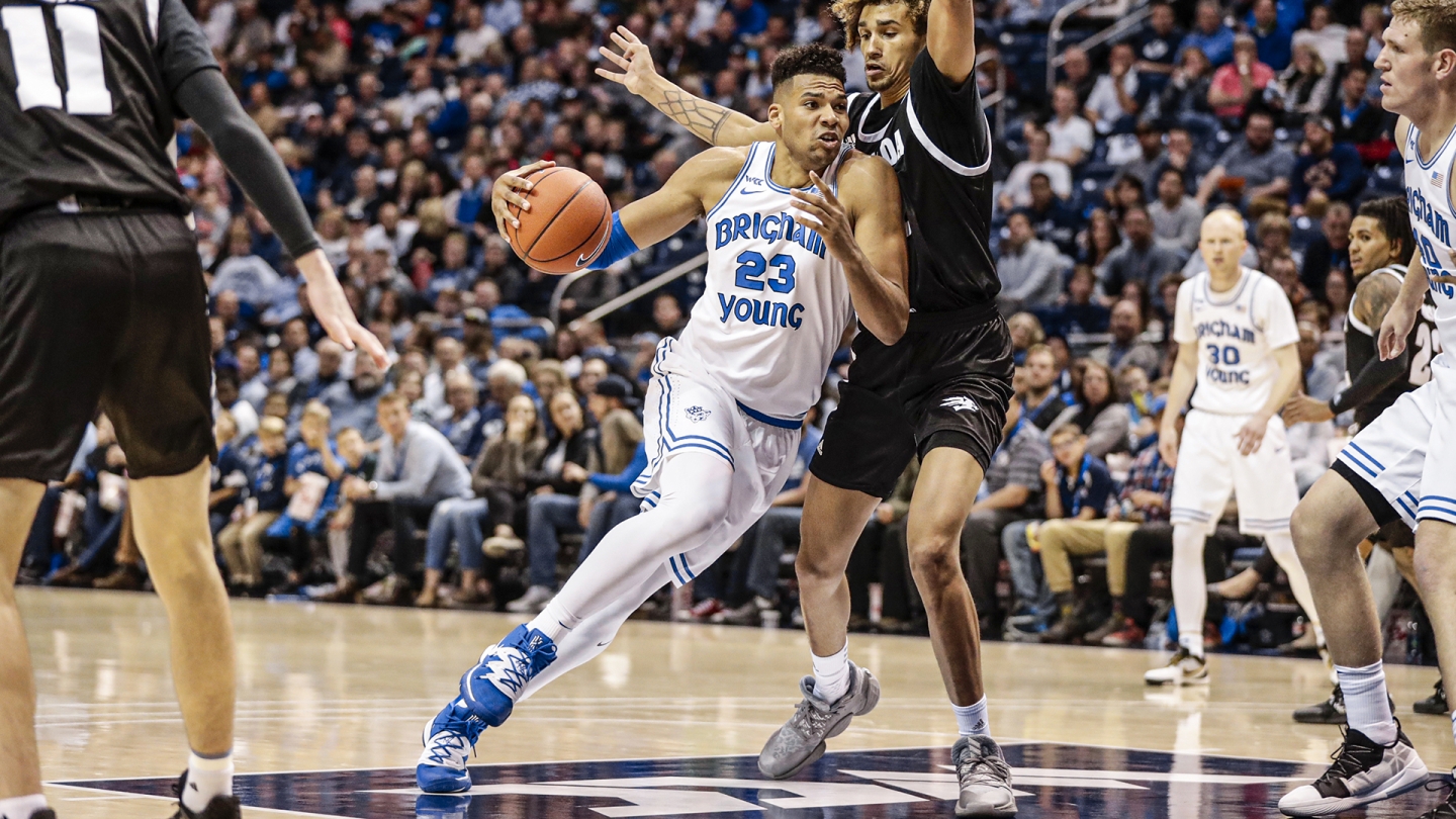 Yoeli Childs drives past a Nevada defender in the Marriott Center.