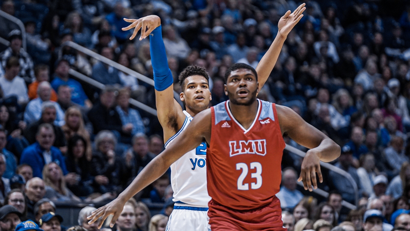 Yoeli Childs holds his follow through after shooting a 3-pointer.