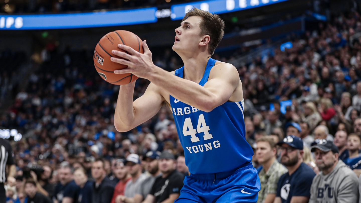 Connor Harding shoots a 3-point shot from the corner of the court against Utah State in Vivint Smart Home Arena.