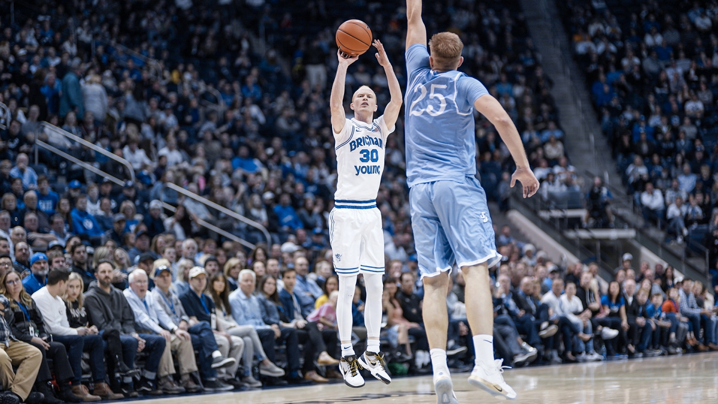 TJ Haws shoots a 3-point shot from the right wing against San Diego.