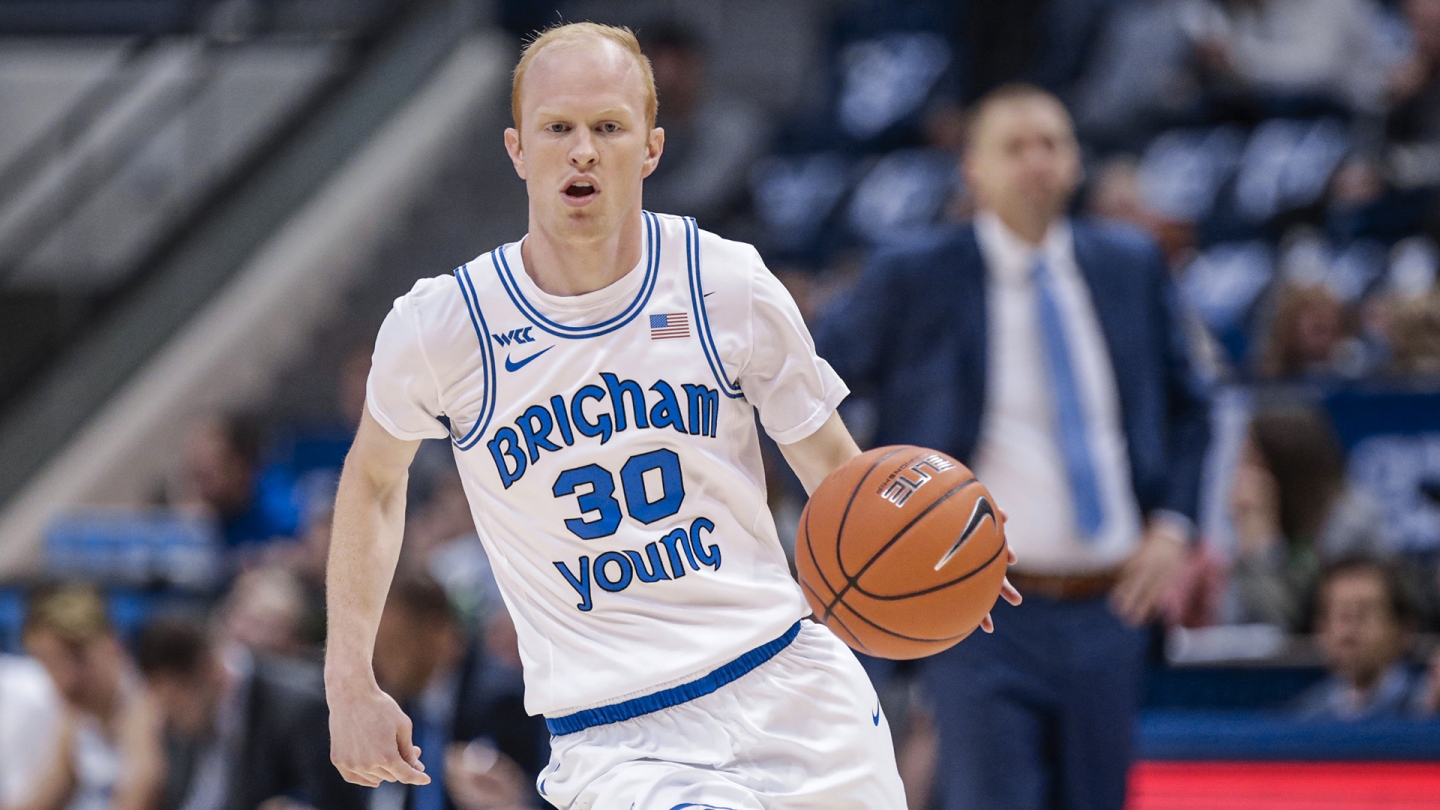 TJ Haws drives the ball up the court against Montana Tech in the Marriott Center.