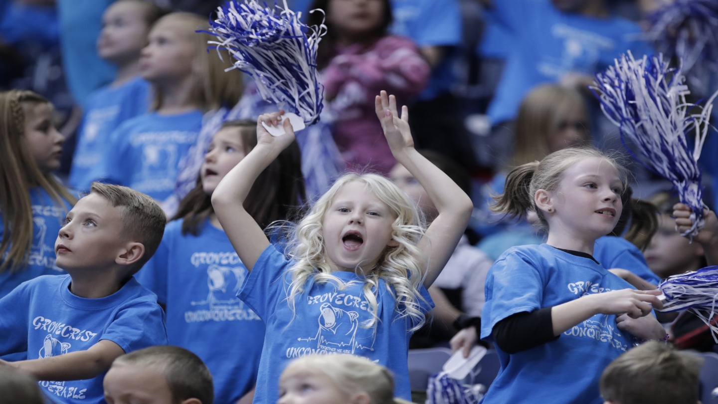 Kids cheering in blue