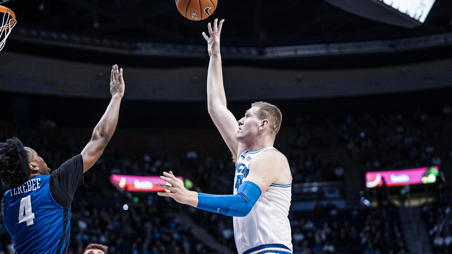 Kolby Lee shoots a hook shot with his right hand against Portland.