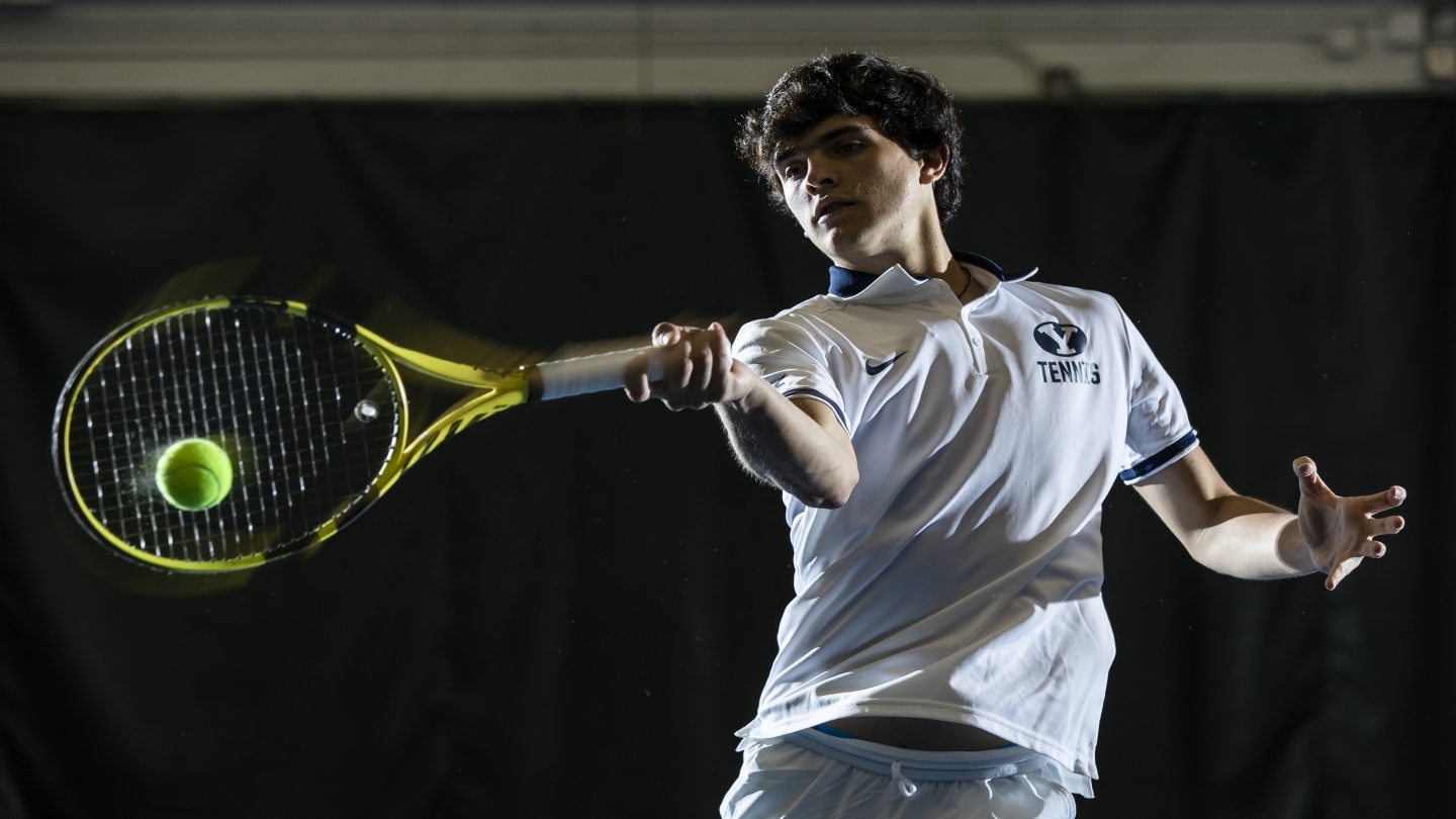 Vinicius Feijao Nogueira swings his tennis racquet.