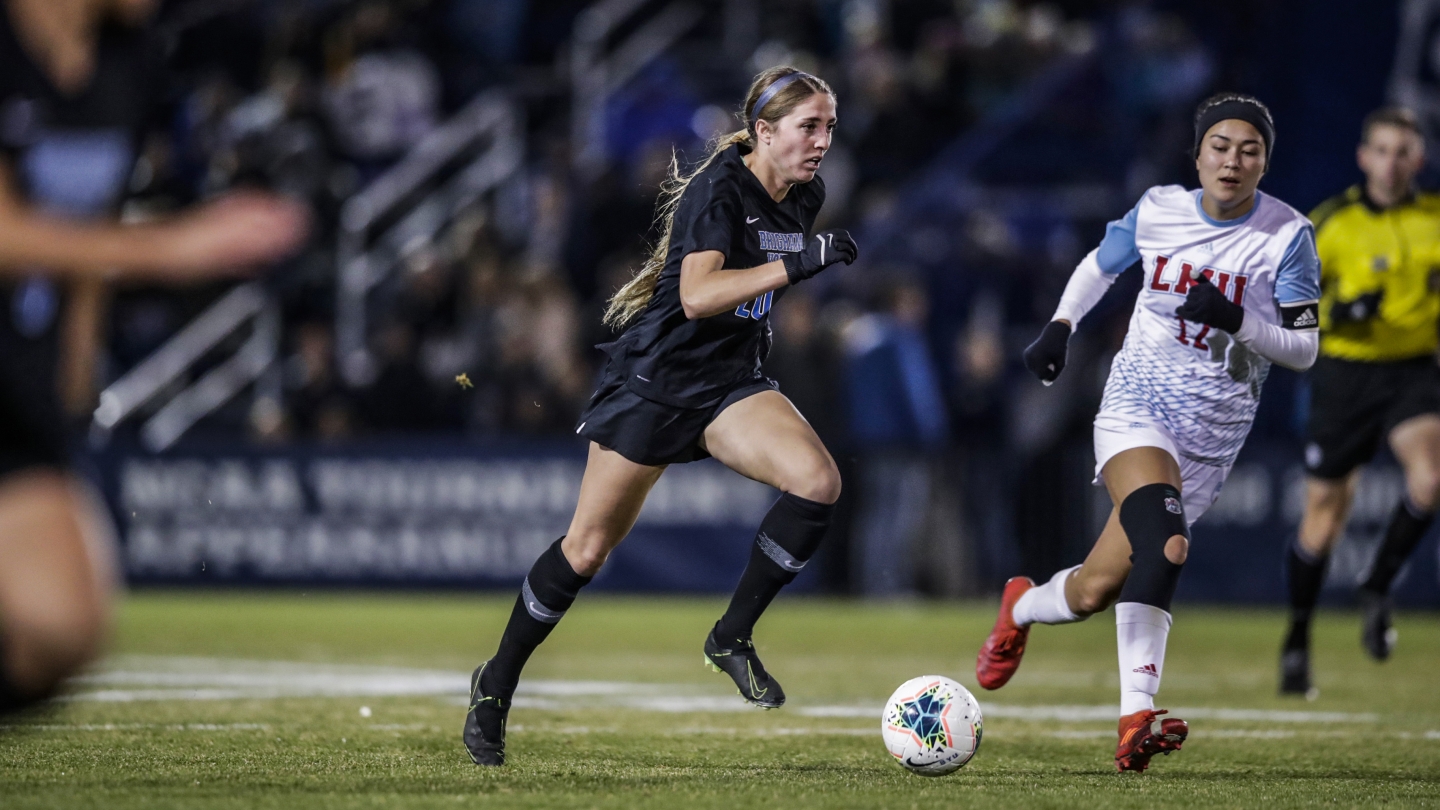 Cam Tucker pushes the ball up the field against LMU