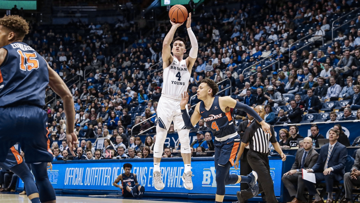 Alex Barcello shoots a 3-pointer while a Pepperdine player defends.