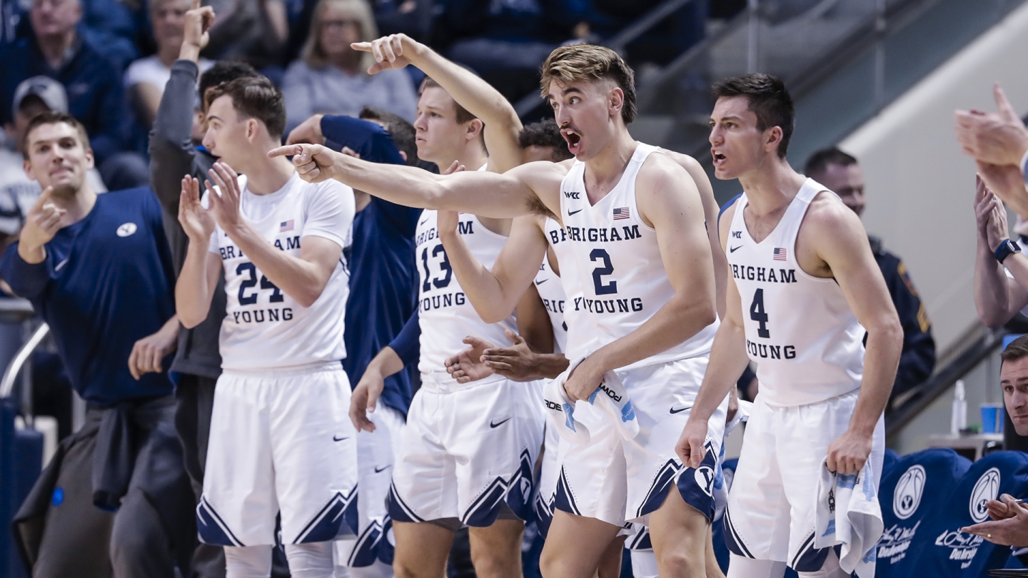 BYU men's basketball's bench celebrates vs. San Diego State.