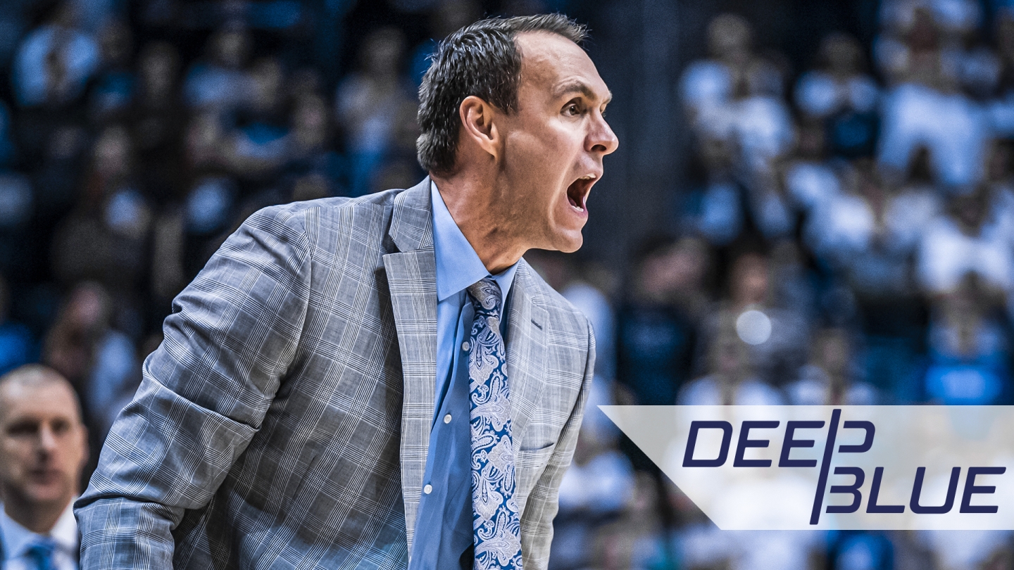 Photo of Chris Burgess coaching with a graphic overlay of the Deep Blue logo.