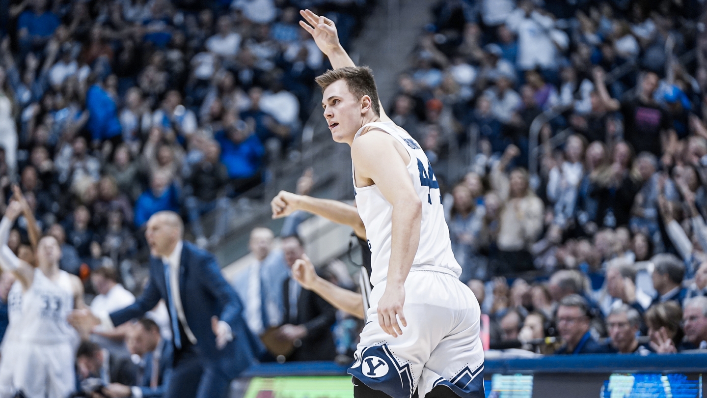 Connor Harding holds up three fingers while running down the court to celebrate a made 3-pointer against Saint Mary's.