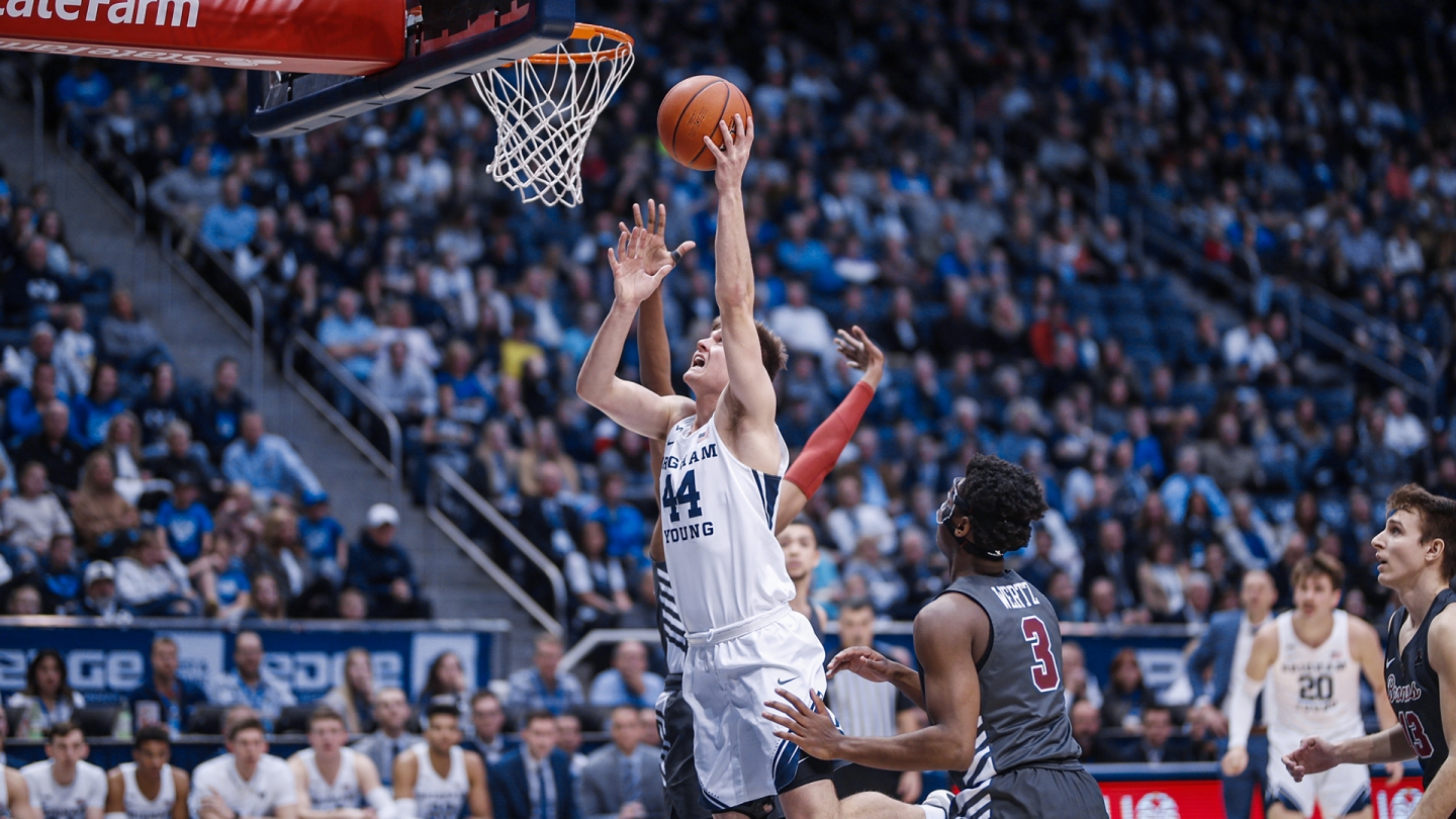 Connor Harding finishes a shot at the rim with his left hand against Santa Clara.