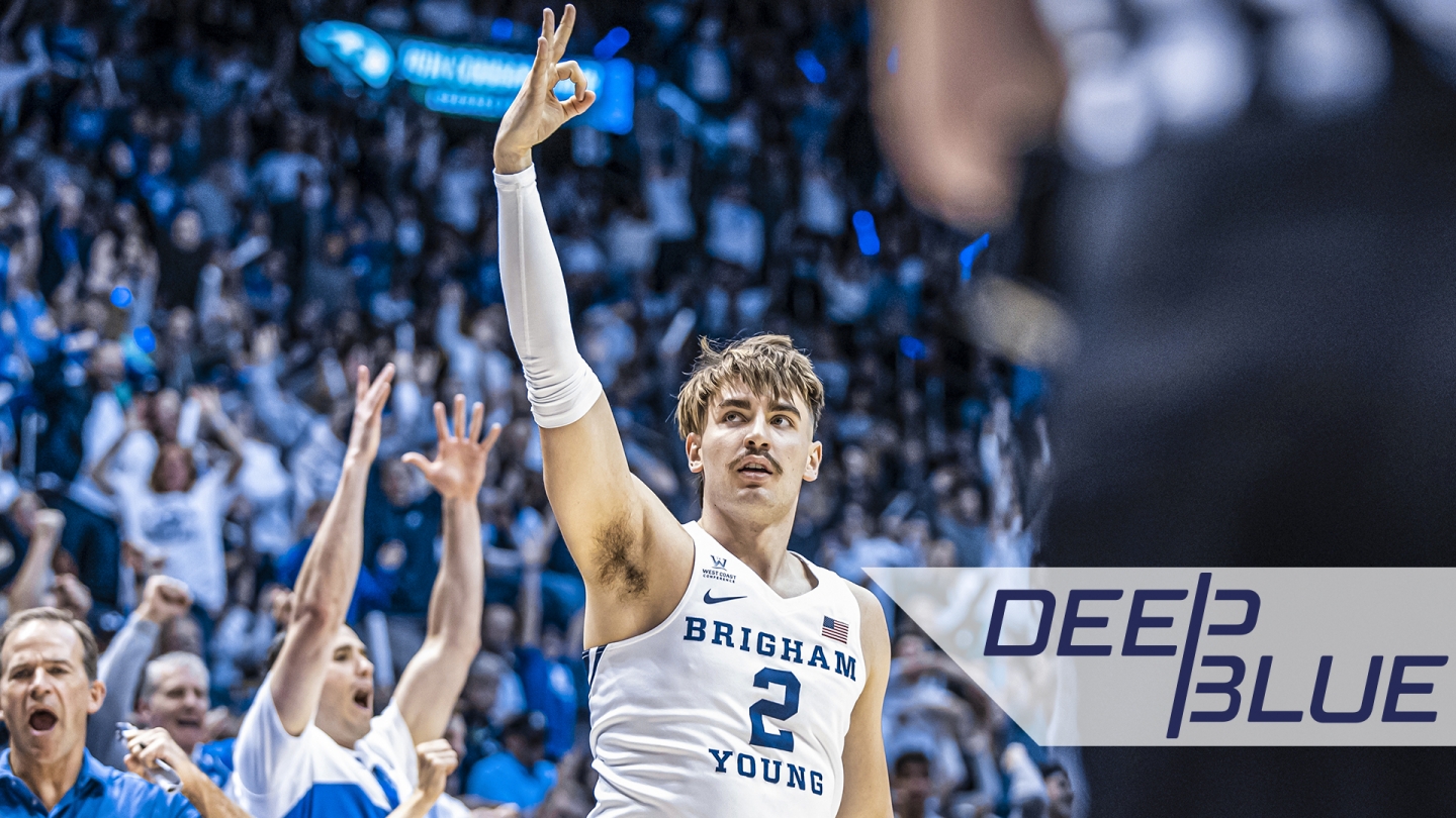 Photo of Zac Seljaas signaling a made 3-pointer with a graphic overlay of the Deep Blue logo.